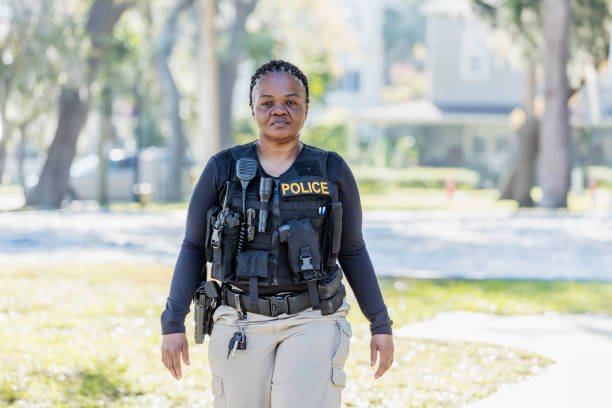 istock African-American policewoman walking in community 1310109058