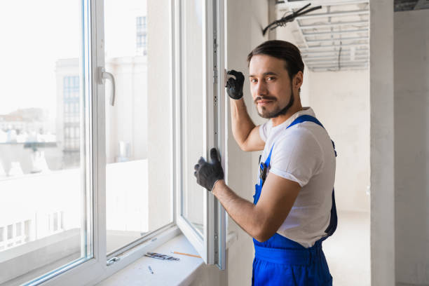 istock The foreman stands at the open window and smiling 1310109061