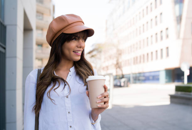 istock Young woman holding a cup of coffee. 1310109076