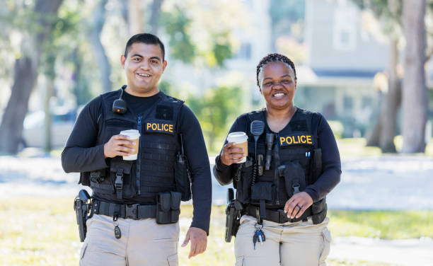 istock Two police officers walking in community 1310109166