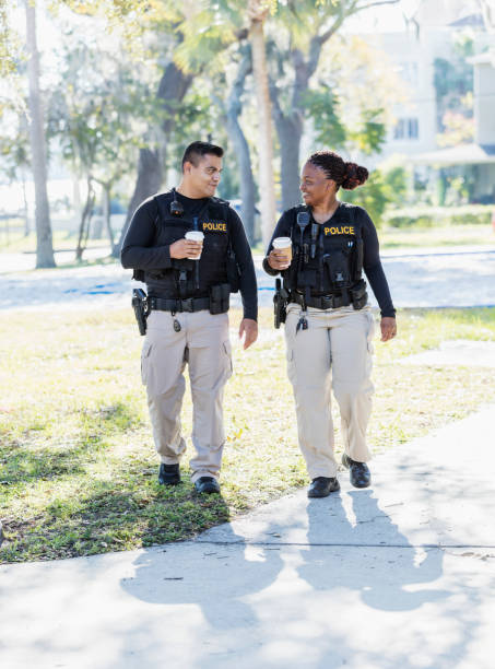 istock Two police officers walking in community 1310109215