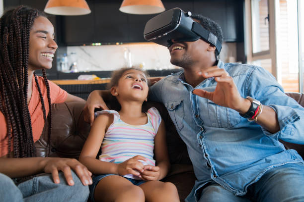 istock Family playing video games with VR glasses. 1310109254