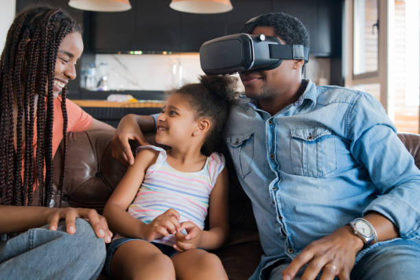 istock Family playing video games with VR glasses. 1310109255