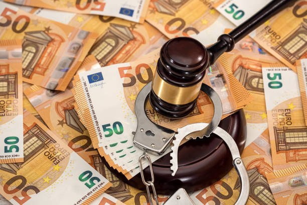 istock Handcuffs and euro banknotes 1310109415