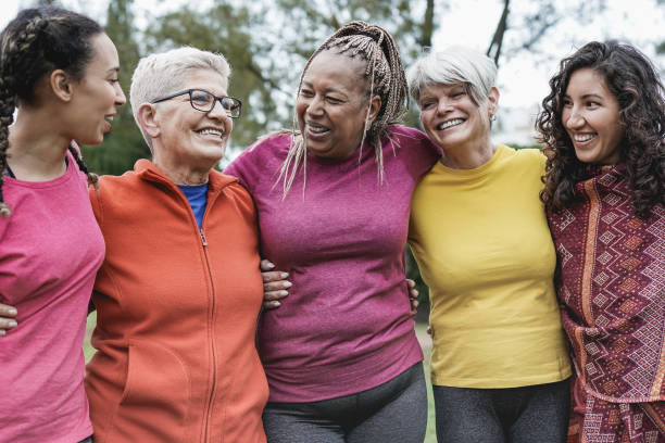 istock Multi generational women having fun together at park - Multiracial people meet and hugging each other outdoor 1310110520
