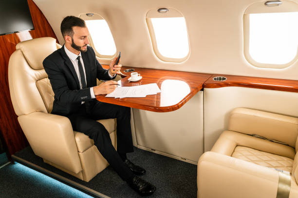 istock Businessman flying on private jet 1310112058