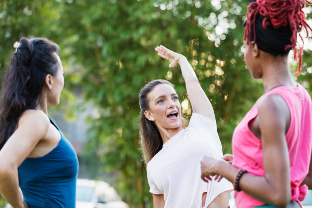 istock Three multi-ethnic women conversing outdoors 1310112141