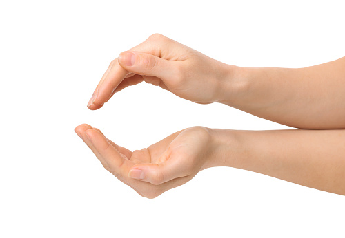 Female hands holding something on white background