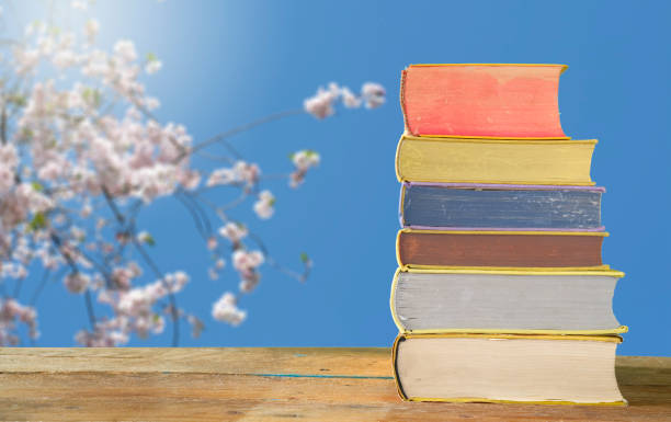 Herbs in alternative medicine with books on vintage background ,still life