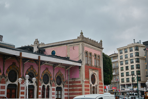 03.03.2021. istanbul Turkey. Corner of the Sirkeci main train station of european side of istanbul. Ottoman patterned and colorful building during overcast weather. Facade of sirkeci train station.