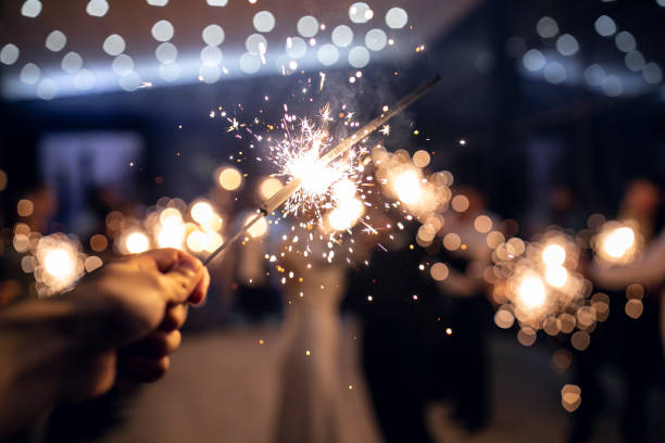 istock sparkler burns in hand.happy new year 2022 1310122354