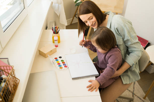 istock Girl with down syndrome creating a masterpiece at home 1310124759