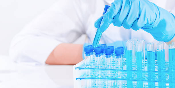 istock A laboratory assistant in a laboratory with test tubes produces vaccine samples. Development in a laboratory of vaccines, drugs. 1310126158