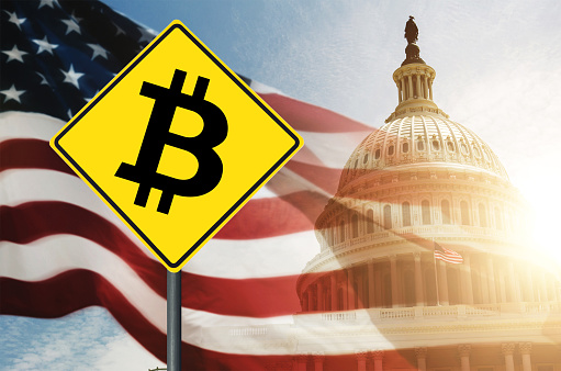 bitcoin street sign against us capitol hill