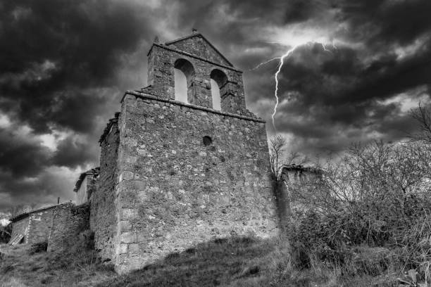 An abandoned hermitage in black and white under a storm An abandoned hermitage in black and white under a storm, Spain lightning tower stock pictures, royalty-free photos & images