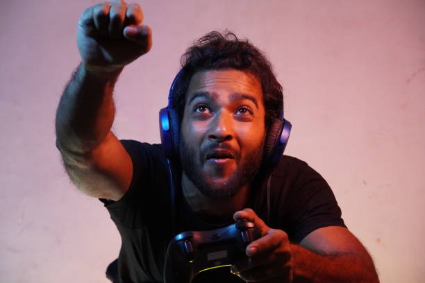 istock Boy playing video game with Joystick and imagining he is in sky 1310127880