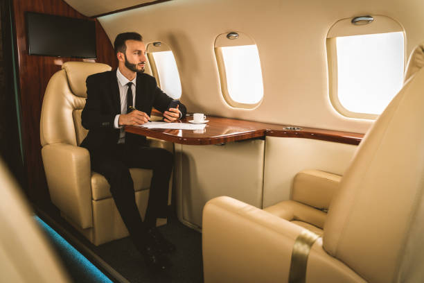 istock Businessman flying on private jet 1310128738