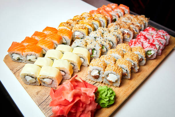 istock Set of various sushi rolls on a board. Close-up, selective focus. 1310130295