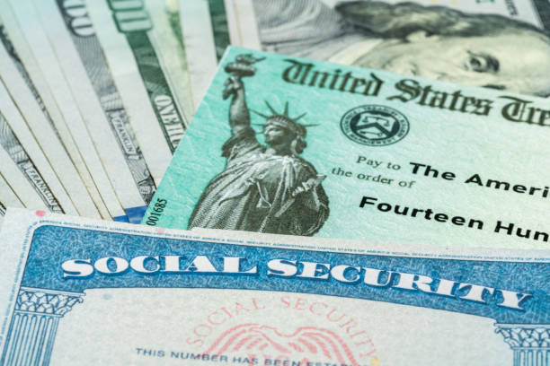 Illustration of the 2021 federal stimulus check from the IRS with cash and social security card stock photo