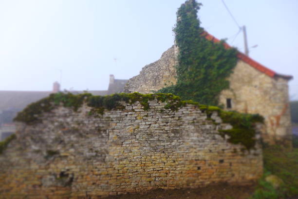 Ruined house with collapsed roof and walls