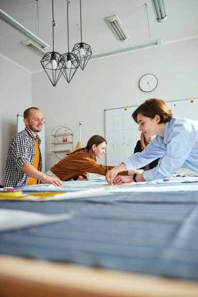 istock Table covered with fabric and fashion team working with it 1310133501