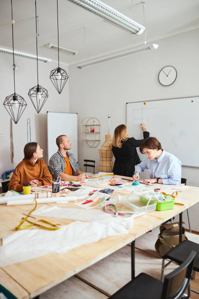 istock Work in the dressmaking establishment with several designers together 1310134260