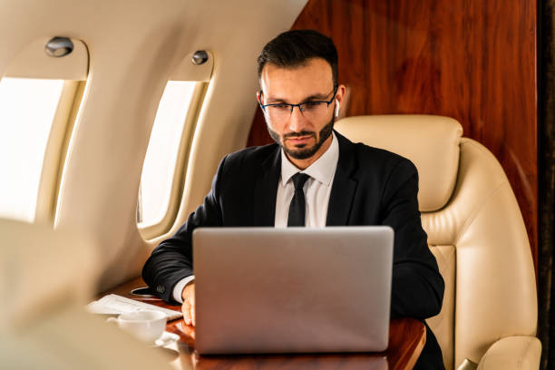 istock Businessman flying on private jet 1310134569