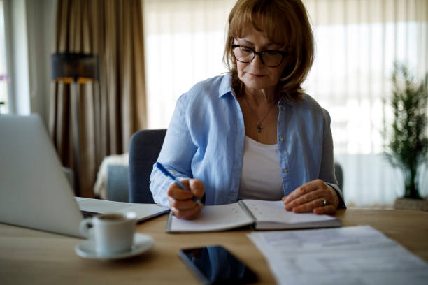 istock Senior woman working at home 1310134731