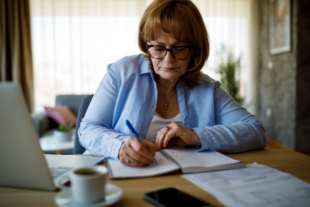 istock Senior woman working at home 1310134750