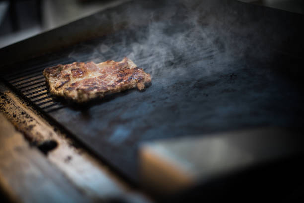 istock Slice of beef roasted on a barbecue grill 1310139001