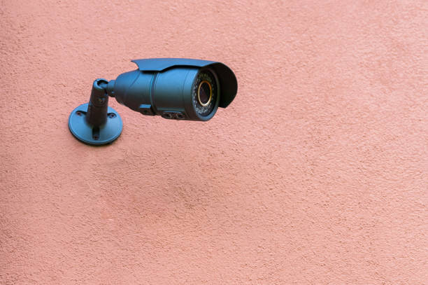 istock Surveillance camera on a street wall 1310141534