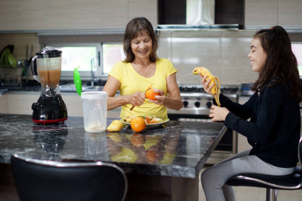istock Grandmother and granddaughter preparing a smooth 1310142106