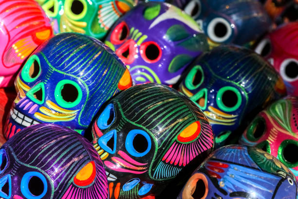 istock Multi-colored ceramic decorative skull. Traditional Mexican souvenirs. The symbol of the holiday of the day of the dead. 1310143364