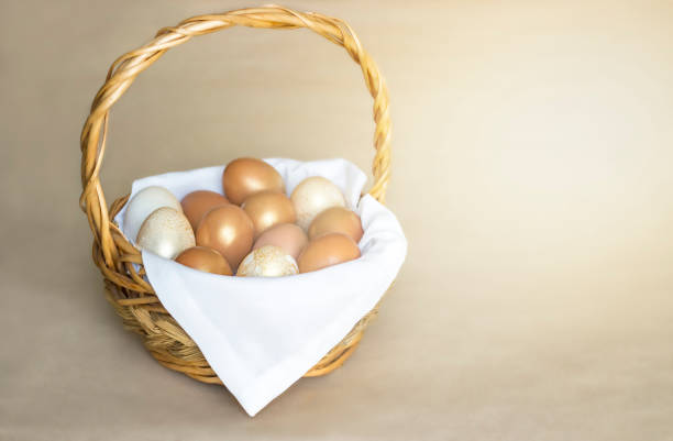 istock basket with Easter eggs stands on a gray background in the rays of the sun. Selective focus 1310144399