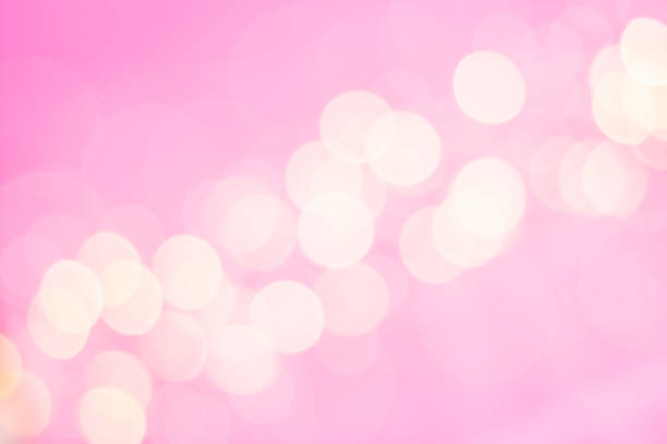 istock strip of defocused white lights on pink background 1310144463