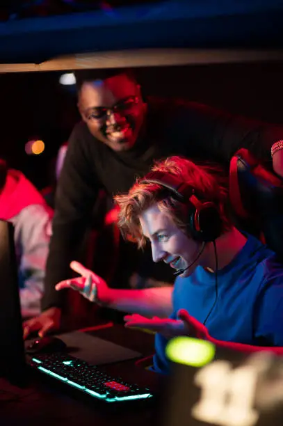 Photo of An online strategy tournament for esports players in the cyber games arena. A professional team of cyber-athletes competes with another crew