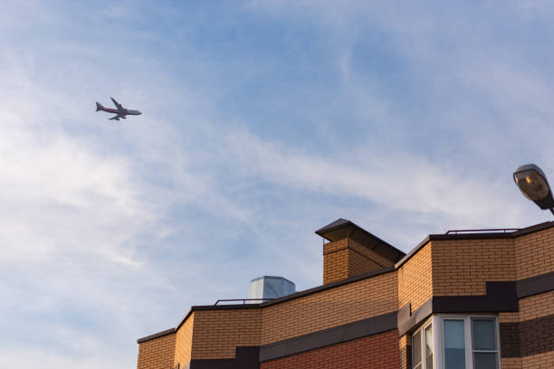 Moscow. Russia. Autumn 2018. The plane over the apartment block. Glissada passes over high-rise buildings. Noise from planes prevents sleep