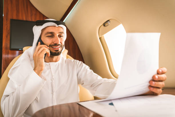 istock Arabian man wearing kandora flying on private jet 1310150001