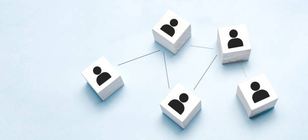 istock Wooden blocks connected together on a blue background. Teamwork concept 1310151481