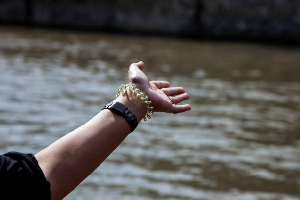 istock Outstretched Womans Hand from a Moving River Boat 1310155713