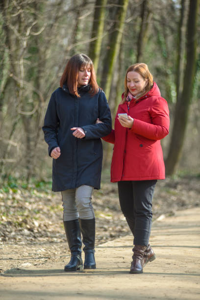 istock Two friends go on a autumn walk together 1310159761