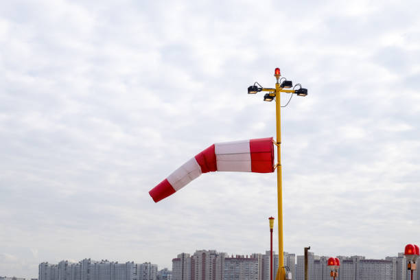 istock Wind index against cloudy sky and city skyline. 1310161564