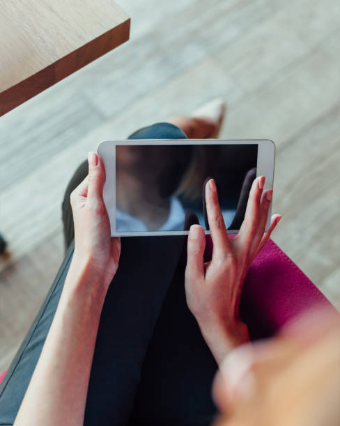 istock Elegant Woman Using Tablet In A Cafe 1310162849