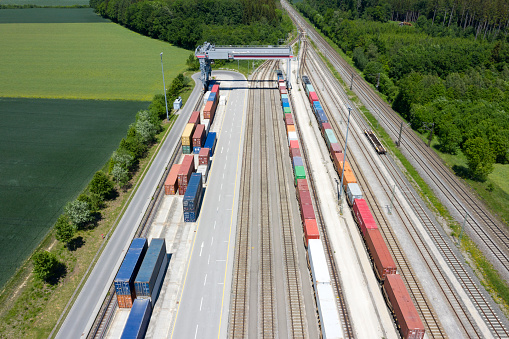 Large group of cargo containers and freight trains, aerial view, Germany, Europe.