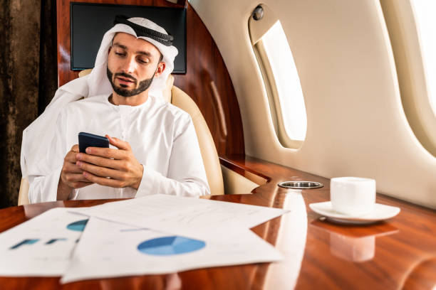 istock Arabian man wearing kandora flying on private jet 1310163846
