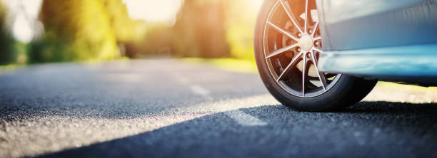 istock Blue car on asphalt road in summer 1310165241