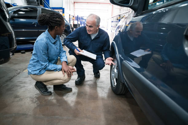istock Senior car mechanic talking with customer 1310166172