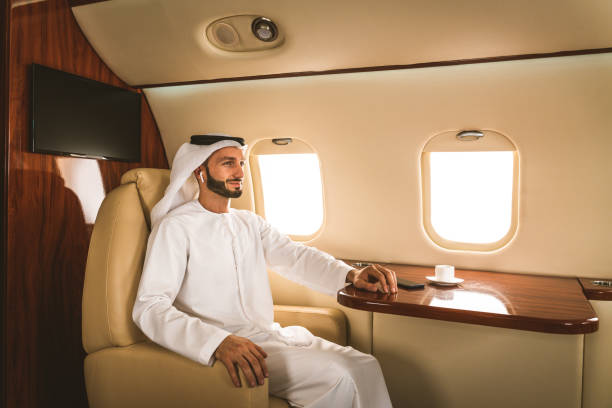 istock Arabian man wearing kandora flying on private jet 1310167394