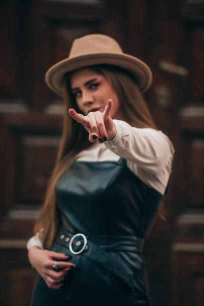 istock Woman showing rock and roll sign with hand 1310167540