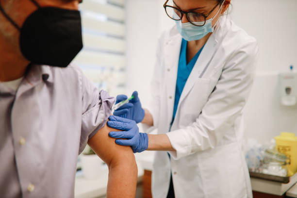istock Close up of a mid aged man getting a vaccine 1310167615